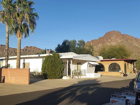 Standing in front of home 