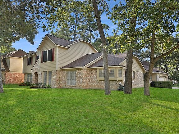 Corner lot shows front of home, the driveway and the 3-car garage on the side. Owner says that school bus will stop at this corner to pick up and drop off students.