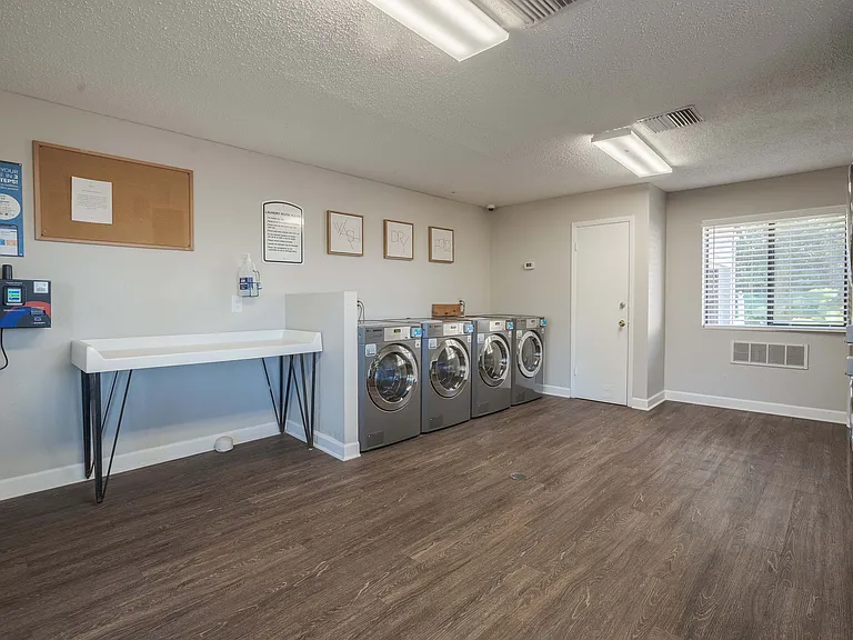 Experience convenience with this well-equipped laundry room, designed for effortless living.