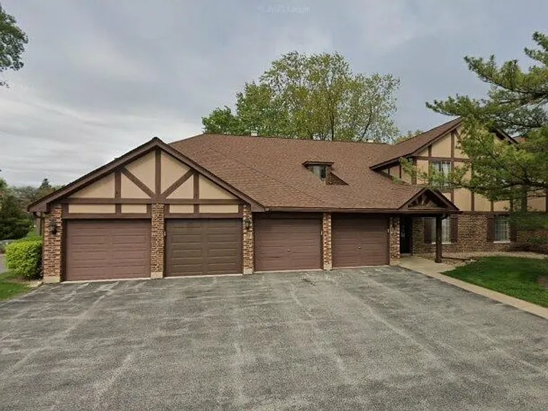 Access to indoor garage space and driveway second from the left