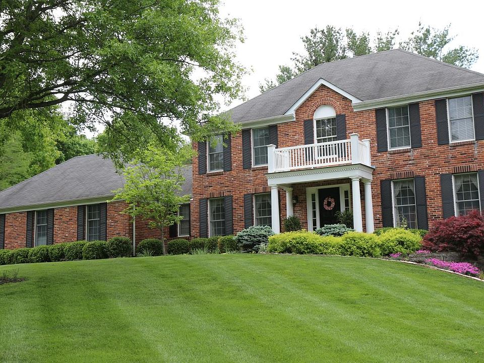 Two-story colonial with large front yard