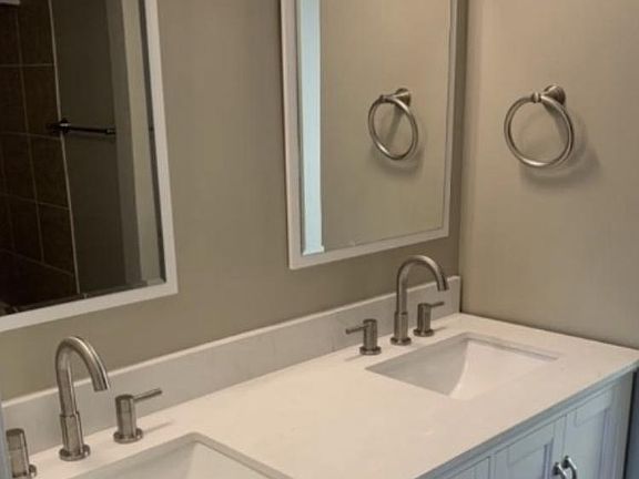 Nice bath opens to both bedrooms.