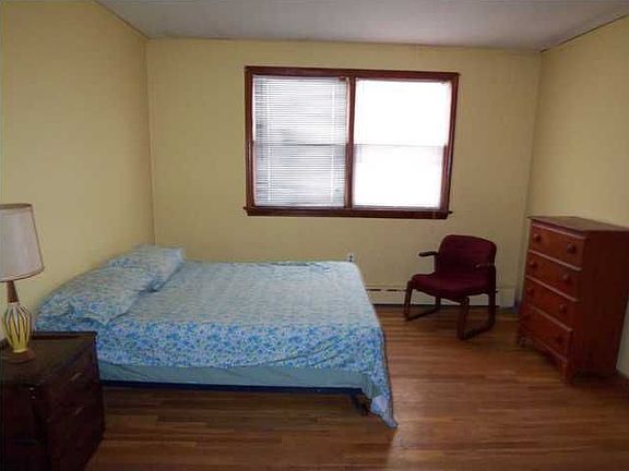 1 of 4 large bedrooms with original hardwood floors