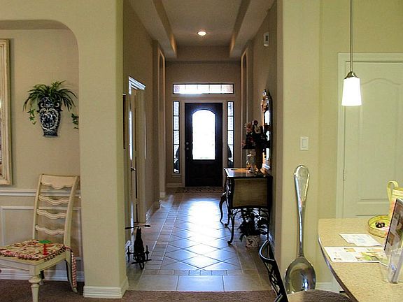Leaded Glass Mahogany Entry Door Leads To Tile Foyer