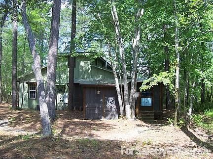 back of house with wrap-around porch
						:
						quiet and peaceful