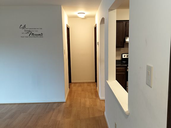 Entryway to the left is the living room with sliding door to patio. On the right is the kitchen. straight ahead to bedroom on the left and bathroom on the right.