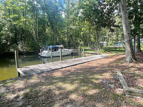 Deep water dock 4.5 to 5 foot depth and about 50 feel long. Note: the boat next door is 27 foot.