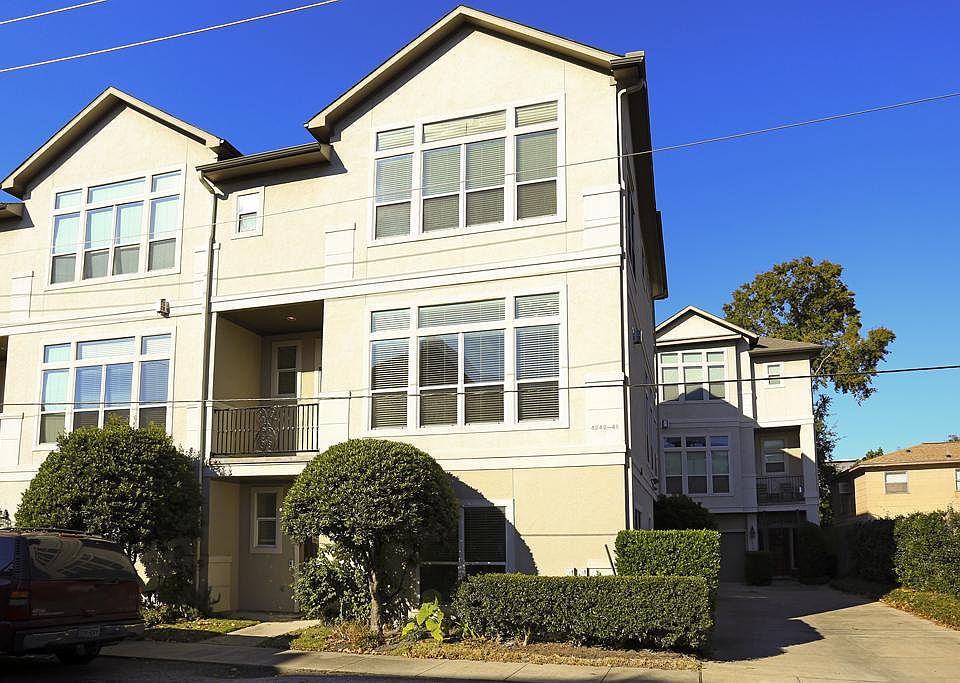 This exceptional townhome is located in the heart of Rice Military, one of Houston's most exciting neighborhoods. Note bank of tall windows at second floor/living level.