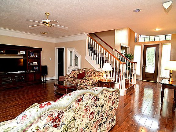 Welcome to the elegant family room! Wide plank, hardwood floor grace the family room along with cust