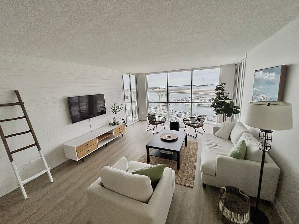 Furnished living room with floor to ceiling windows