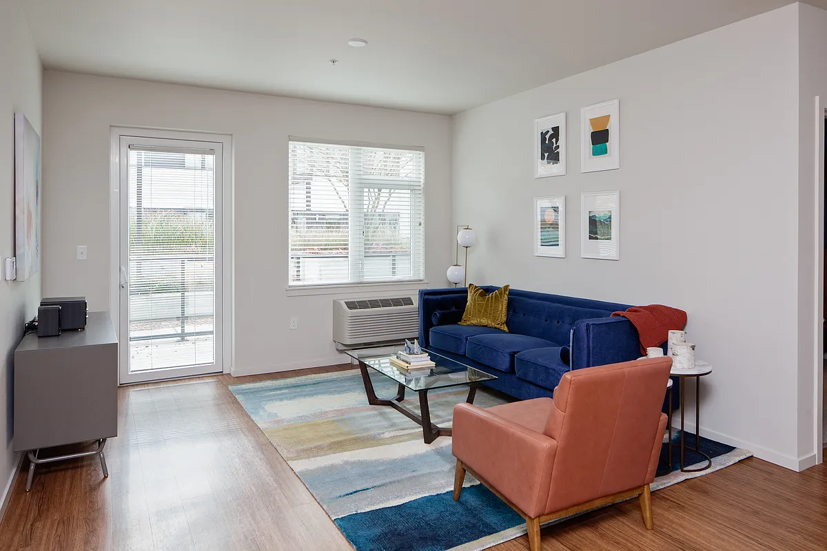 Grant Park Village living room shot with blue couch and orange leather chair - Grant Park Village