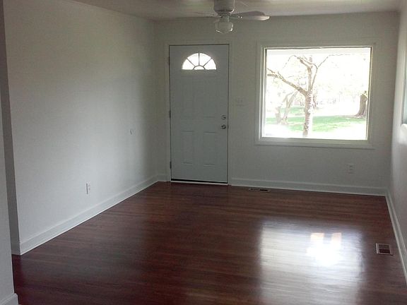 Living room has a big picture window for lots of natural lig