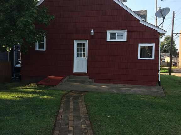 Back of house with patio