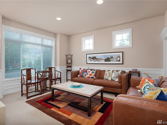 Formal living room with bright windows