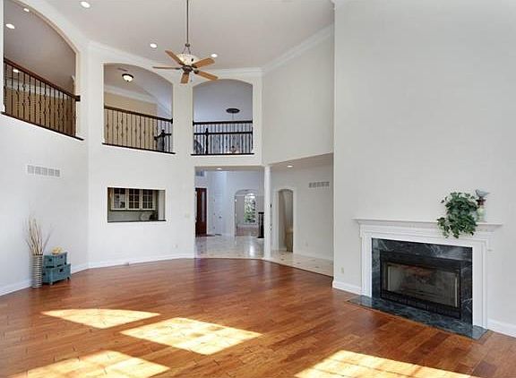 Beautiful wrought iron rails surround the great room from the upstairs loft sitting area.
