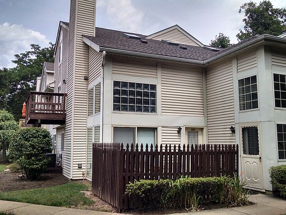 Side entranceway to the right of the fence