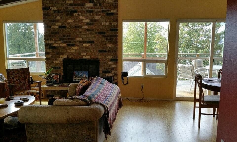 Living room looking out towards deck and view