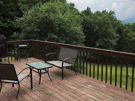 Large wrap-around deck with mountain views