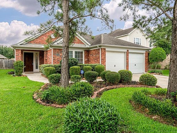 Mature trees and lush landscaping provides great curb appeal!