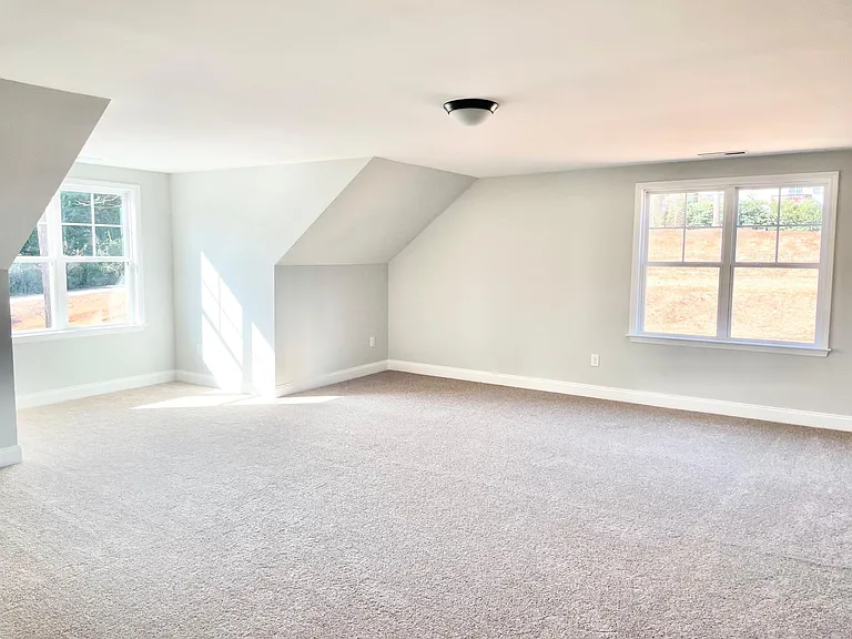 massive bonus room above garage. Also has large closet for storage in additional to attic storage