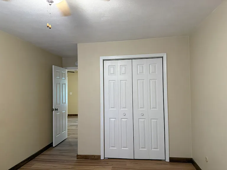 bedroom closet, with door on left to the living room