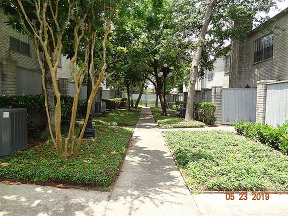 Walkway to unit from driveway (where there is additional parking). Unit is the last section to the right of the walkway.
