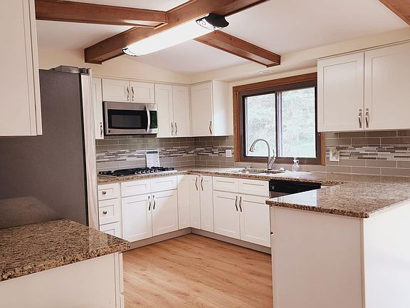Updated kitchen with SS appliances, granite and new cabinets.
