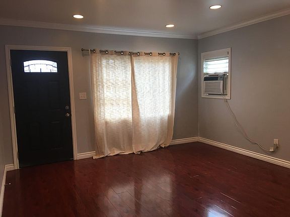 A/C in the main living area, lovely polished floors and calming gray walls