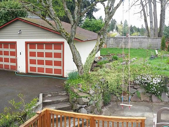 Two-car garage, private driveway, and backyard