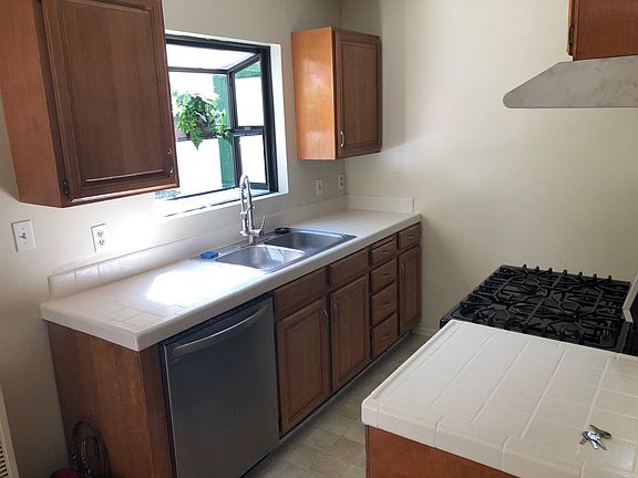 Kitchen with new dishwasher, restaurant style faucet, garden window