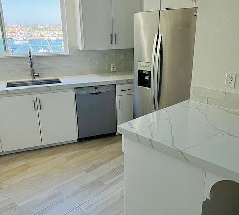 Kitchen with view of the Bay, refrigerator and dishwasher