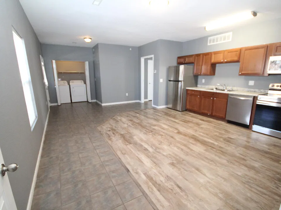Front door to left by washer dryer