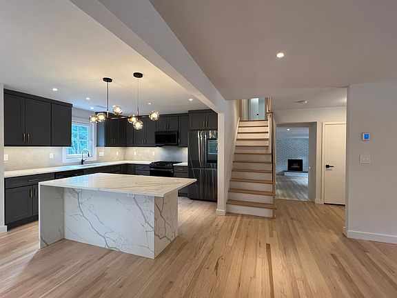Entry to 2 nd floor & step down to additional rooms