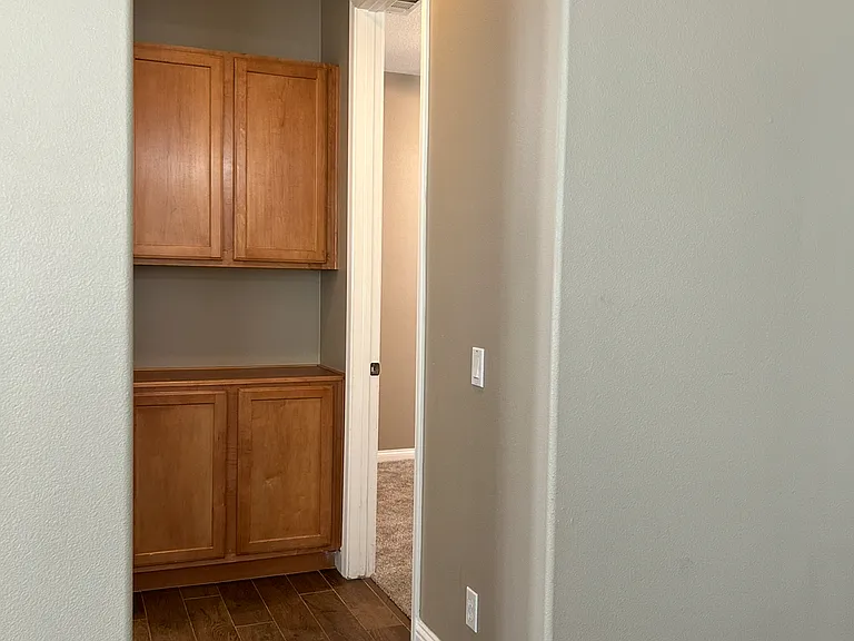 hallway to the 1st bedroom