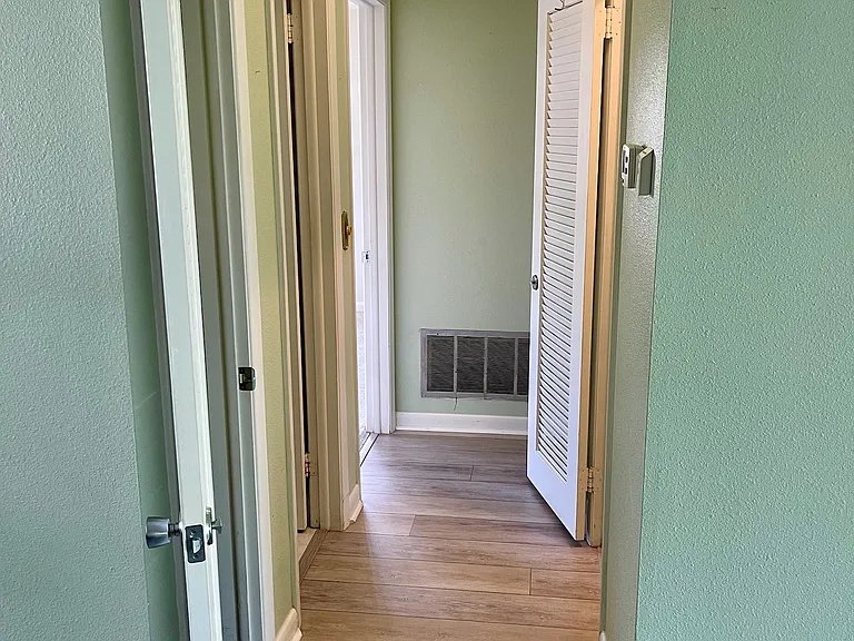 Hall with linen closet & walk-in coat/storage closet
