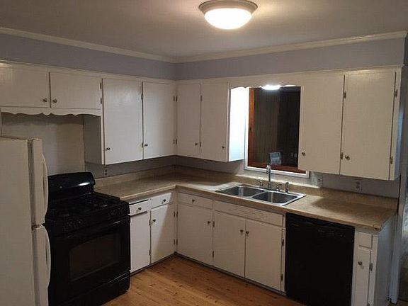kitchen with stove. dishwasher. fridge