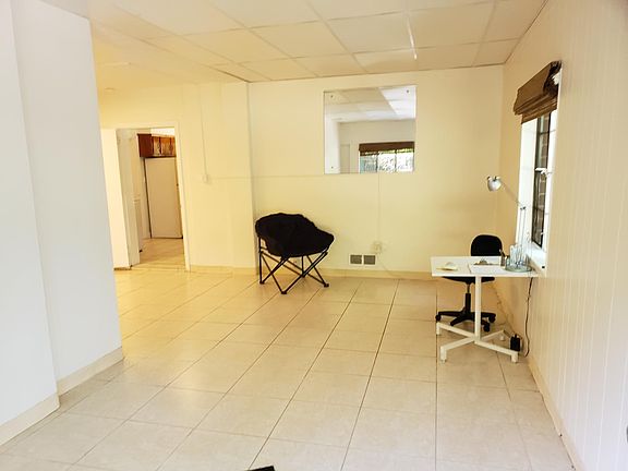 Great room (office/den/media/living/dining) opening onto patio