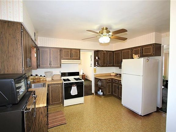 Plenty of Cabinets in HUGE 16x13 Eat-in Kitchen including Refrigerator, Gas Stove & Dishwasher. Very Nice Vinyl Flooring & Attra