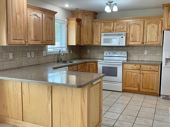 Large kitchen with pantry closet. Fridge, stove/oven, microwave, dishwasher included.