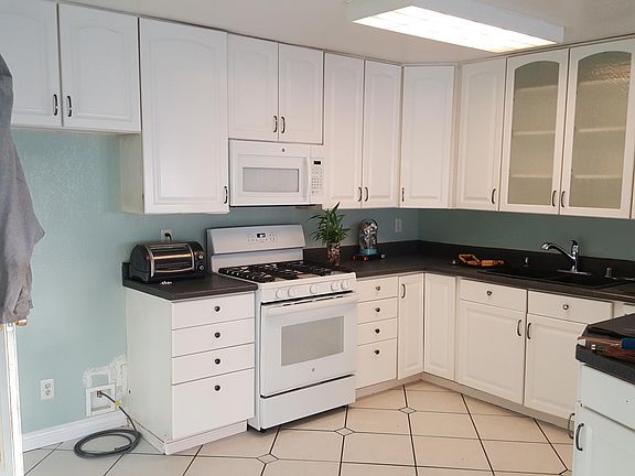 Wide open large bright and light kitchen.
