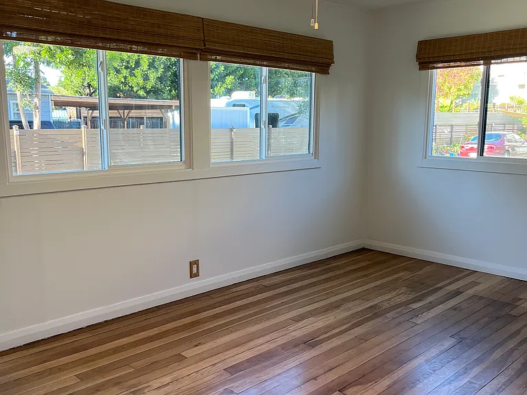 The living room with brand new window shades.