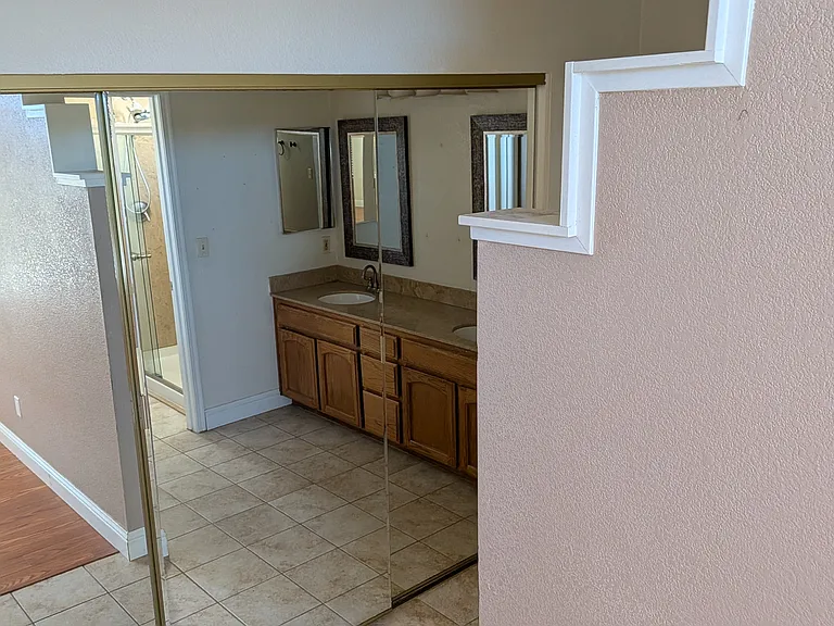 Master Closet leading to Bathroom attached to master bedroom.