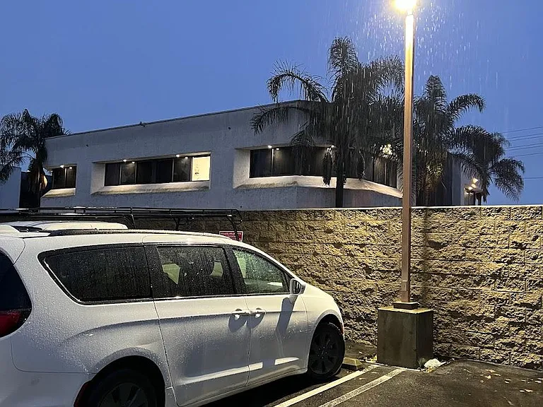 Dedicated parking (#14) spot under light.