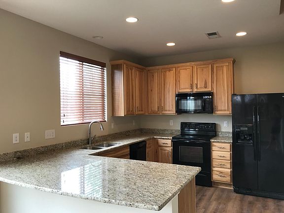 Modern Kitchen with Granite Countertops and Beautiful Cabinets