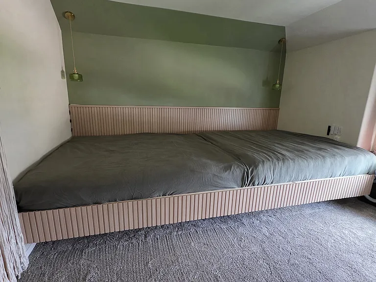 Primary room- wall to wall floating bed frame. Will remove unless renter wants to retain. Accent wall will remain. Half painted/half paneling.
