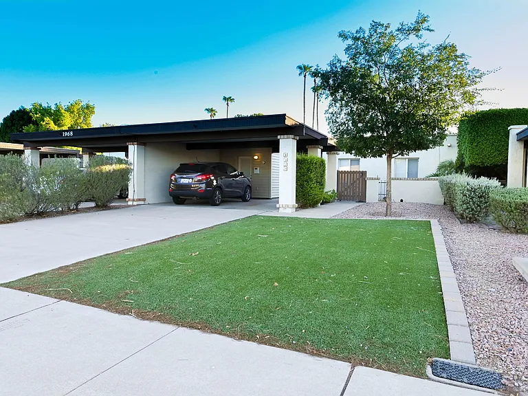 Front of house with turf lawn