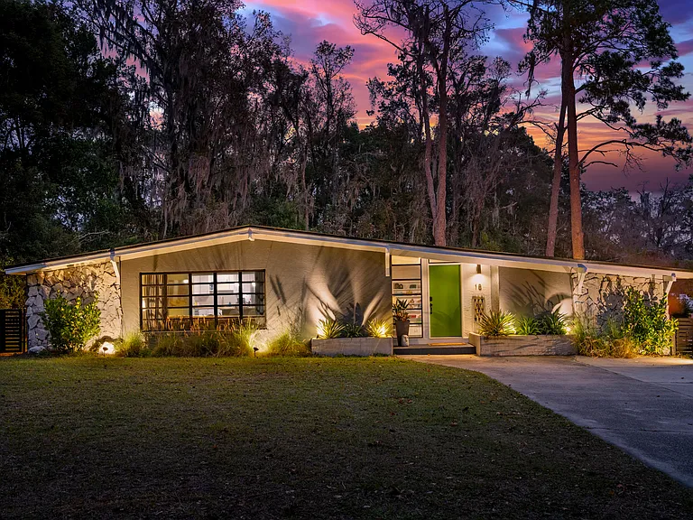 Beautiful Mid Century Modern located in quiet neighborhood less than a mile from Brooksville Elementary School and Hernando High School. Long double width driveway provides plenty of parking. Fenced backyard, landscape lighting, digital lock.
