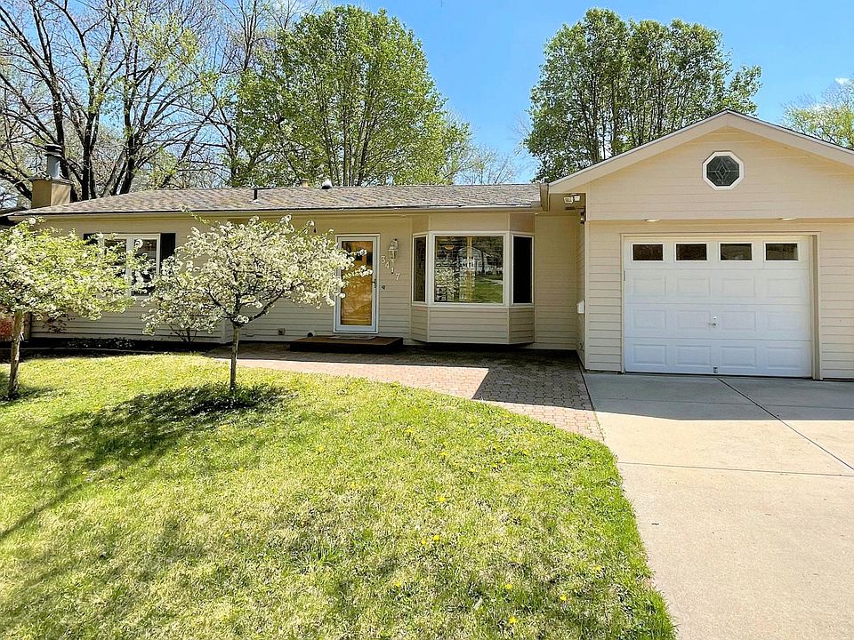 House faces north; large oak in front yard not pictured