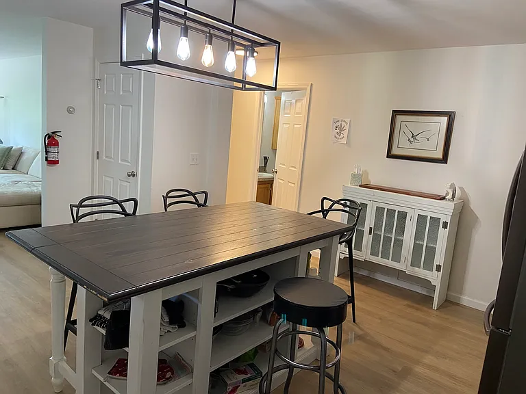 View from the back corner of the kitchen towards Hallway Bathroom and Hallway towards the Master BR