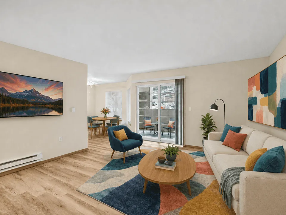 Spacious open living and dining area with direct access to a private covered patio.